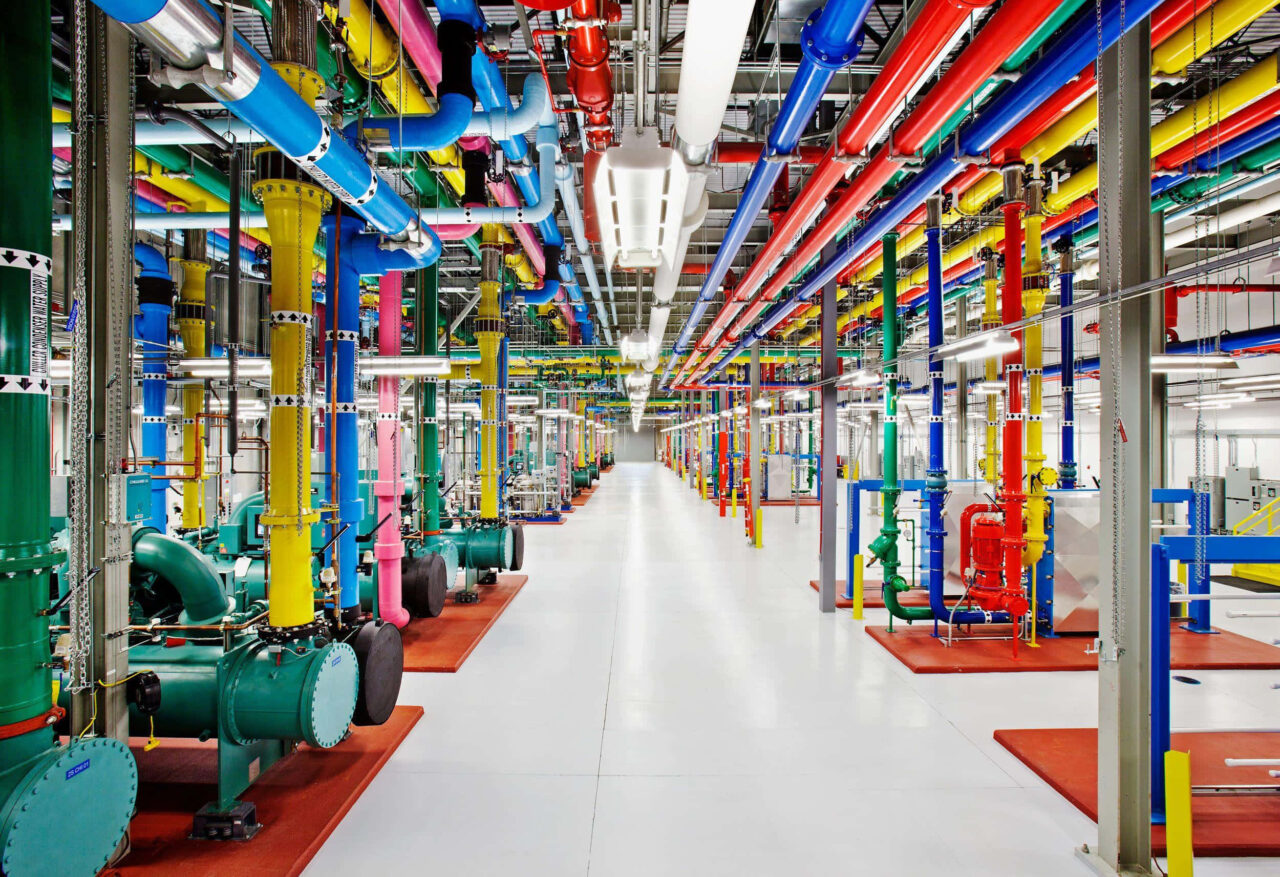 Vibrant industrial factory wallpaper with colorful pipes and modern clean corridor design