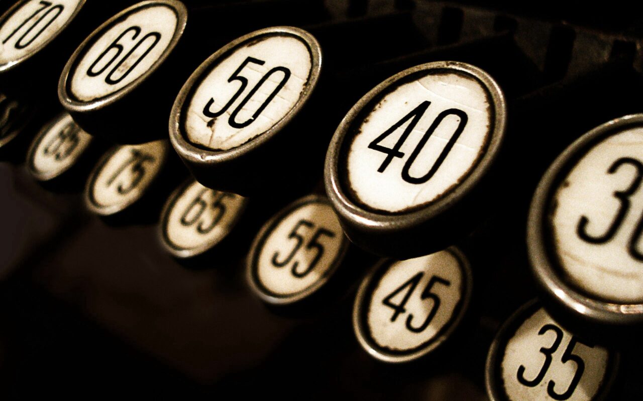 Vintage Typewriter Keys Close-Up: Classic Black-and-White Wallpaper
