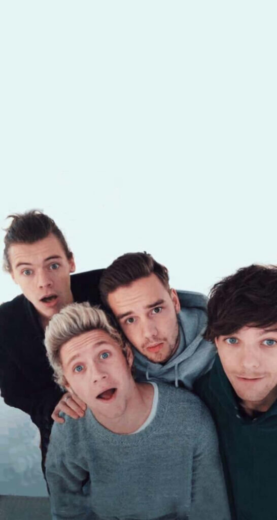 Magical Melodies: 1D's Captivating Quartet Enchants on Dreamy iPhone Wallpaper
