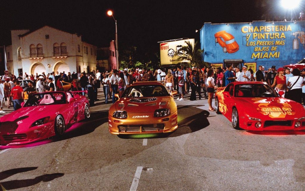 Night Miami street racing with pink Honda S2000 gold Toyota Supra red Mazda RX-7 wallpaper