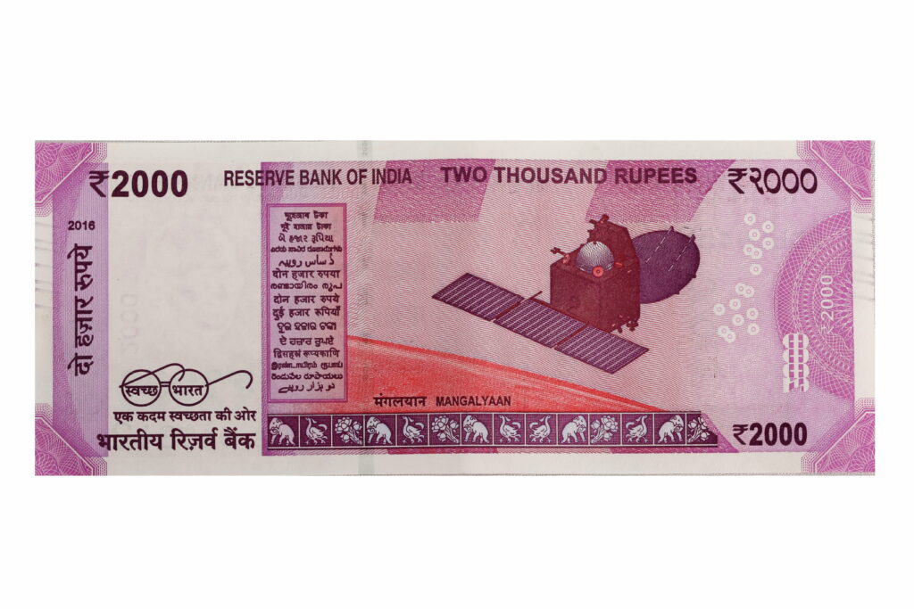 Reverse side of 2000 Indian Rupee note featuring Mangalyaan Mars Orbiter and Swachh Bharat logo Wallpaper