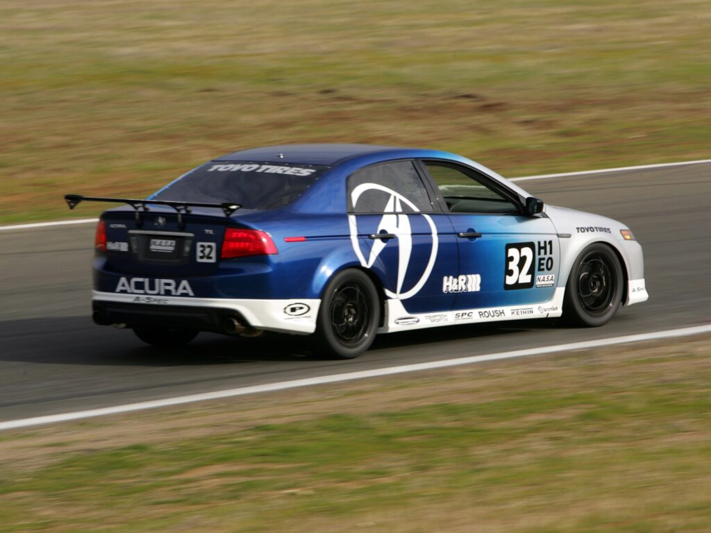 2004 Acura TL Blue Wallpaper: Dynamic Racetrack Side View