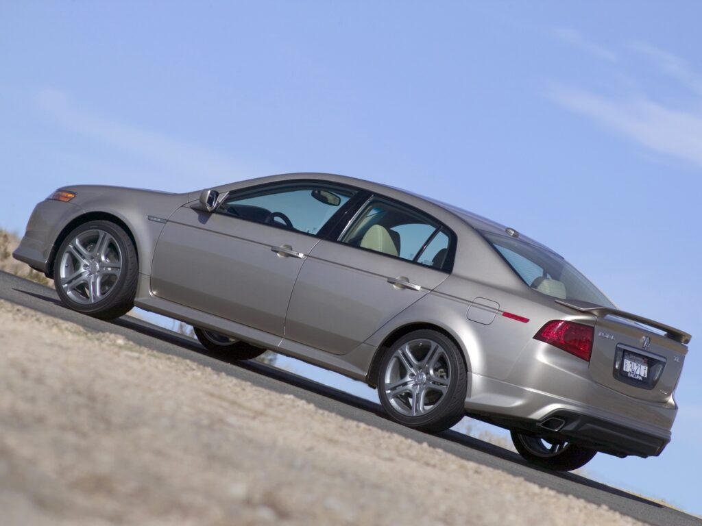 Sleek 2004 Acura TL in Metallic Gray Against Clear Sky Wallpaper
