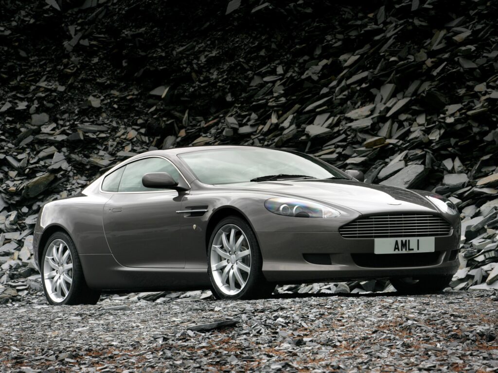 2004 Aston Martin DB9 in Metallic Gray - Sleek Side View Wallpaper
