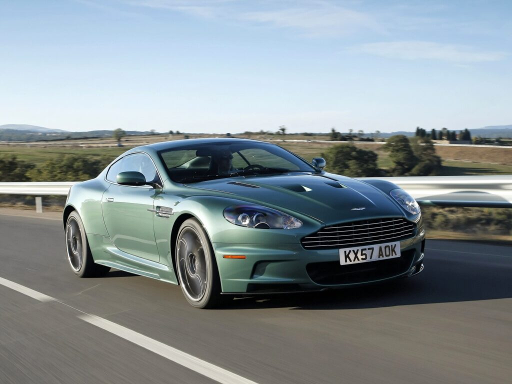 2008 Aston Martin DBS in Green: A Sleek Drive on Open Road Wallpaper
