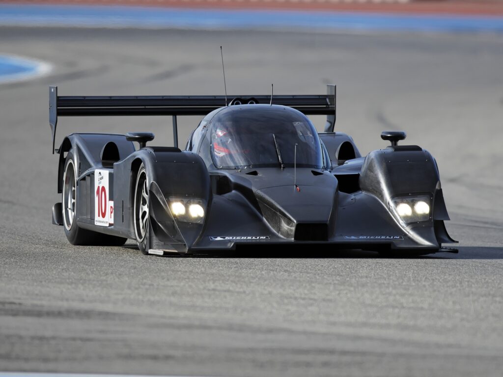 Sleek 2008 Aston Martin Race Car on Asphalt Track - Front View Wallpaper