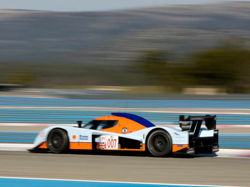 2009 Aston Martin LMP1 Racing Car Wallpaper - Dynamic Side View