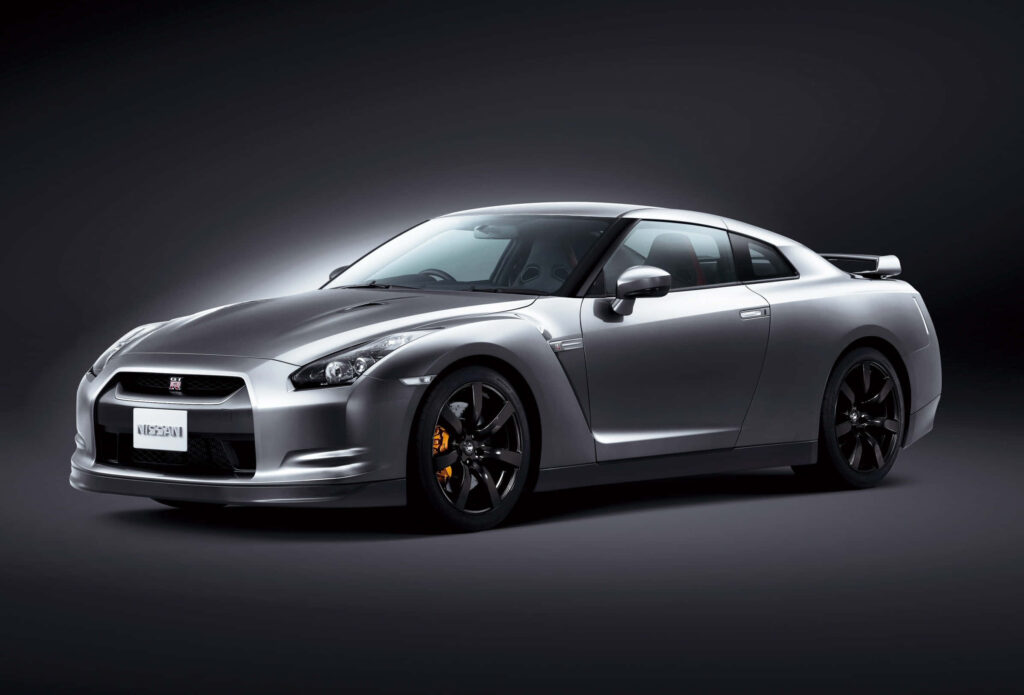 2009 Nissan R35 GTR silver luxury sports car with aerodynamic design on dark background wallpaper