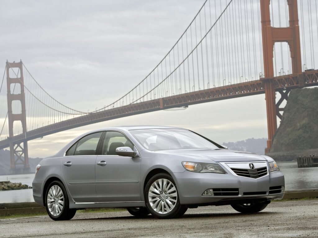 2010 Acura RL: Sleek Gray Sedan on Scenic Road with Bridge View Wallpaper