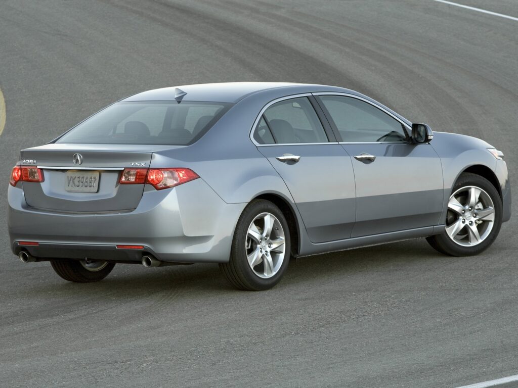 Sleek 2010 Acura TSX in Metallic Gray on Smooth Asphalt Wallpaper