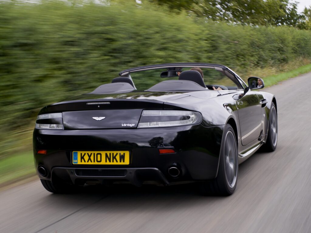 2010 Aston Martin V8 Vantage: Sleek Black Convertible Wallpaper