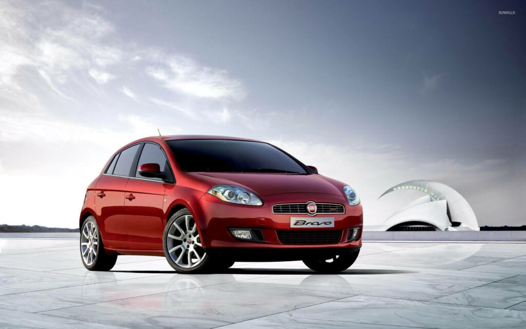 2010 Fiat Bravo Hatchback Wallpaper: Bold Red in Modern Setting