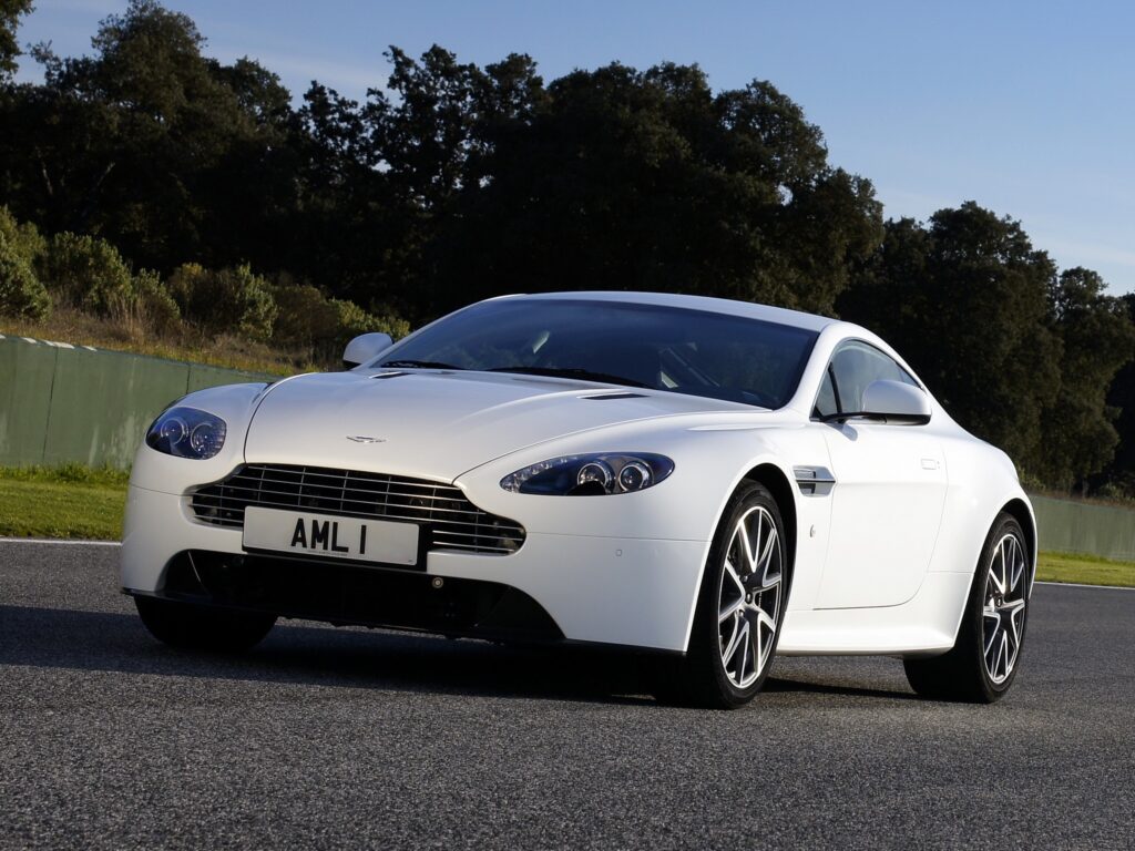Stunning 2011 Aston Martin V8 Vantage Wallpaper with Green Trees