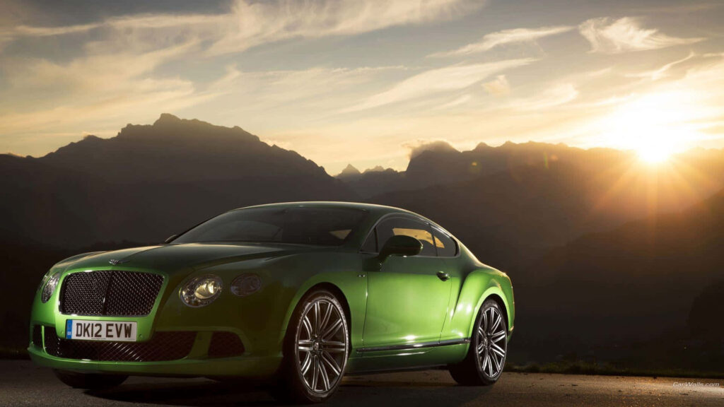 Sunset Glow: Showcasing the 2013 Bentley Continental GT in Striking Green Wallpaper