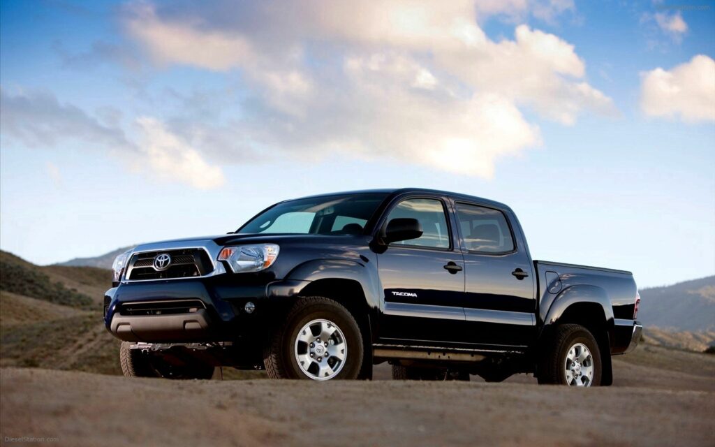 2013 Toyota Tacoma Side View Wallpaper with Scenic Background