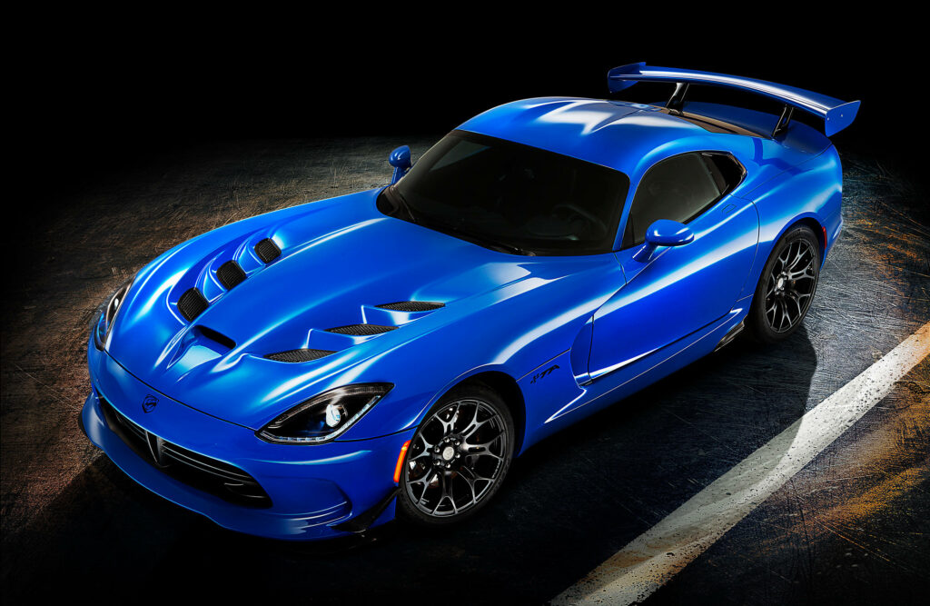 2015 Dodge Viper GTC blue sports car with aerodynamic curves and rear wing on dark background Wallpaper