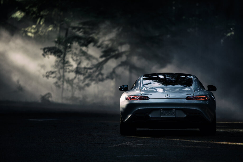 Sleek 2016 Mercedes-Benz AMG GT S in Moody Forested Background Wallpaper