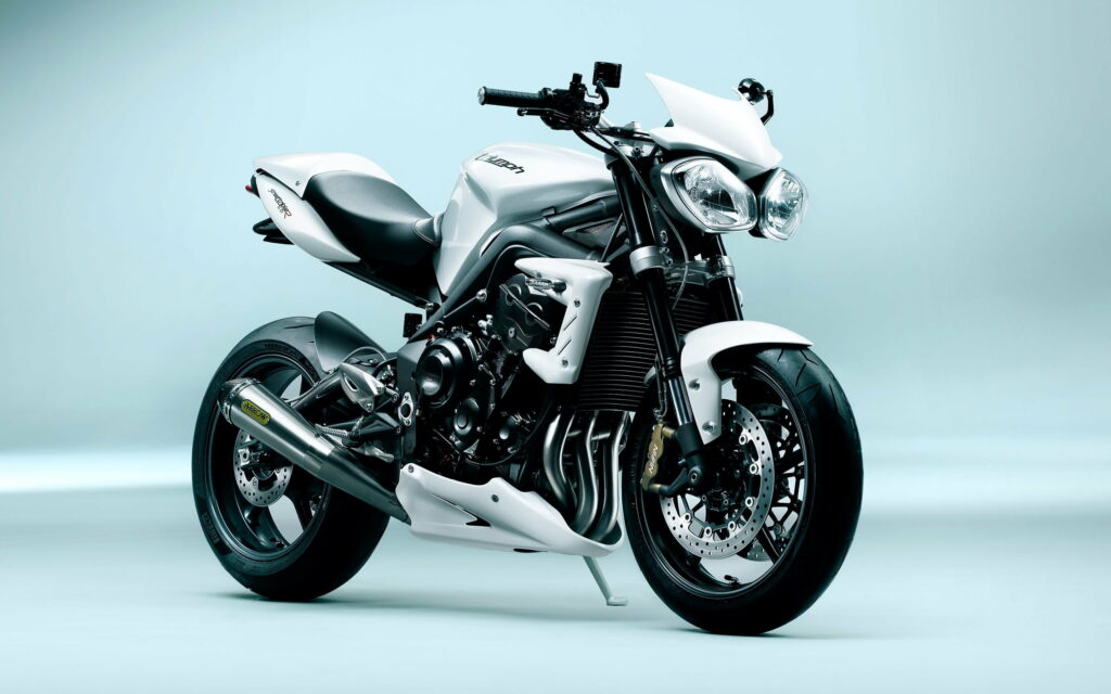 Racing Elegance: Captivating White Triumph Sport Bike in a Striking QHD Wallpaper