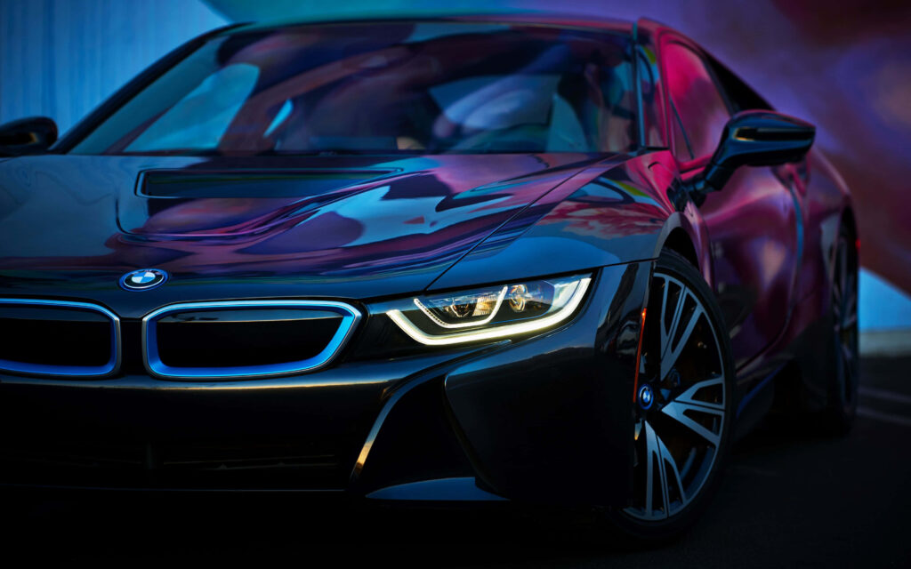 Sleek black 2017 BMW i8 with vibrant reflections and sharp LED headlights wallpaper background