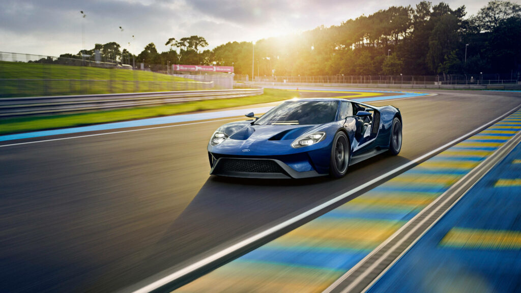 2017 blue Ford GT racing on track sleek aerodynamic design dynamic sports car wallpaper