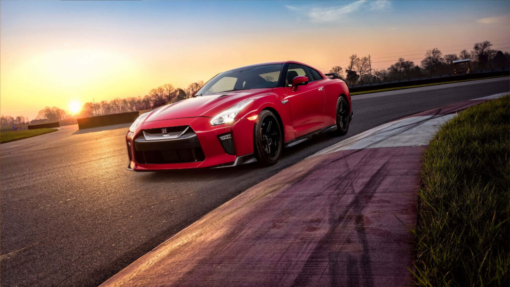 2017 Nissan R35 GTR red parked on racetrack at sunset showcasing aggressive design wallpaper
