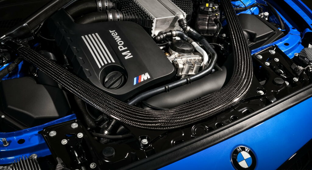 Power in Motion: 2020 BMW M2 CS Coupe Unleashes Engine Roar Wallpaper