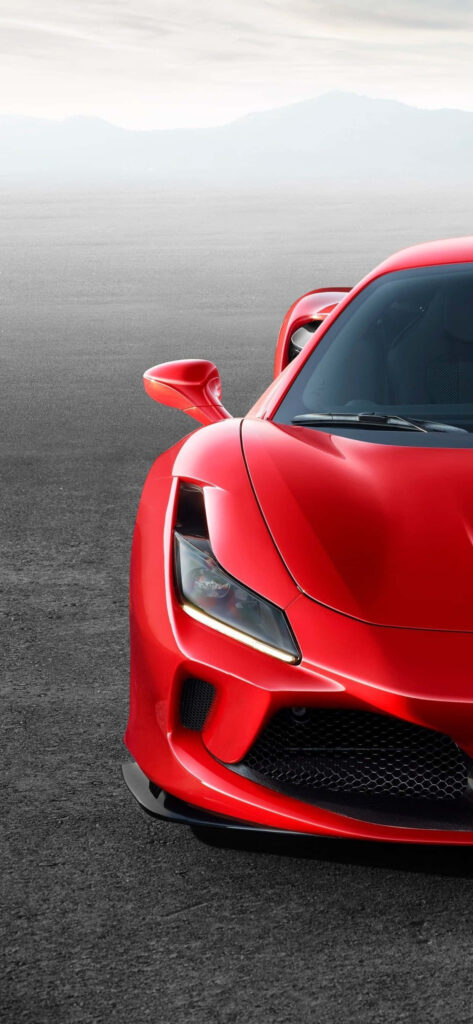 Close-up of red 2020 Ferrari F8 Tributo showcasing sporty elegance and aerodynamic design outdoors Wallpaper