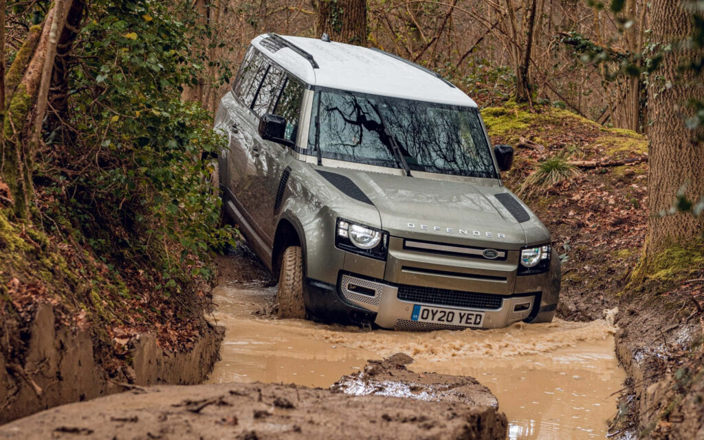 2022 Land Rover Defender: Off-Road Wallpaper in Scenic Forest