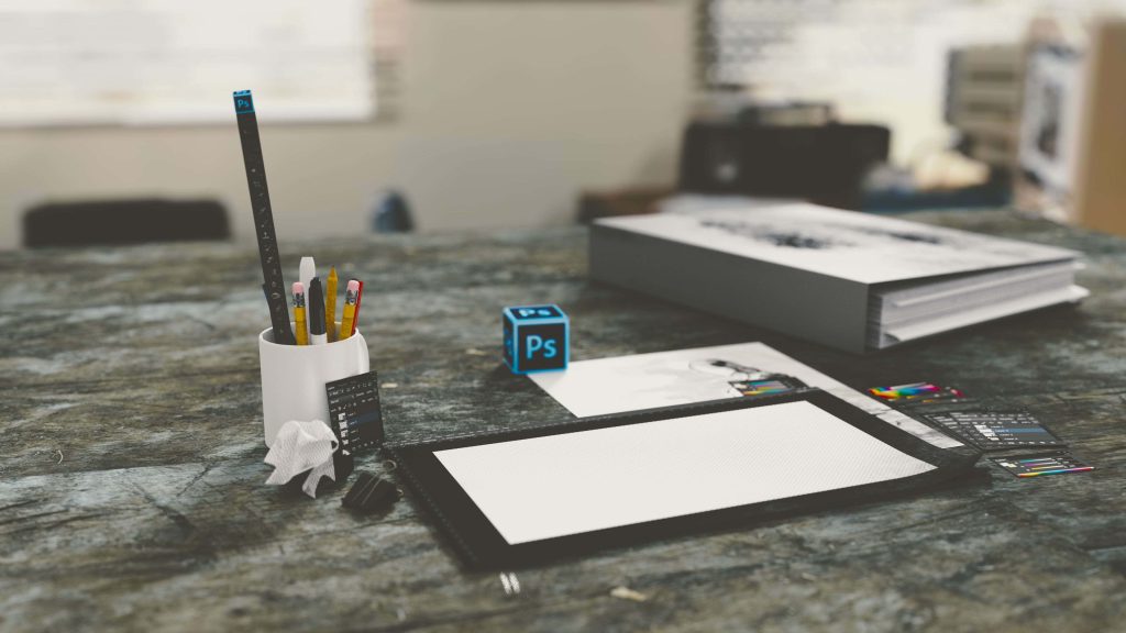 3D digital art desktop wallpaper with Adobe Photoshop logo cube and graphic tablet tools