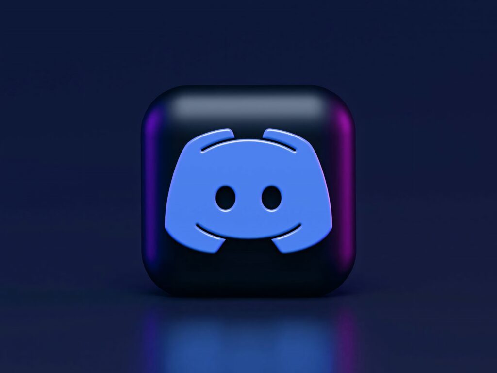 3D cube with blue Discord logo on dark purple indigo gradient background tech wallpaper