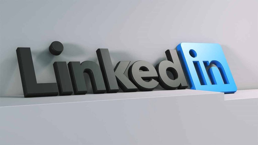 3D LinkedIn wallpaper with matte black Linked text and vibrant blue in logo on gray background