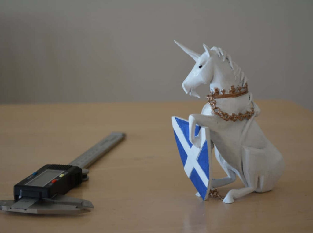 3D-Printed Unicorn Model in Workshop: Crowned with Shield Design Wallpaper