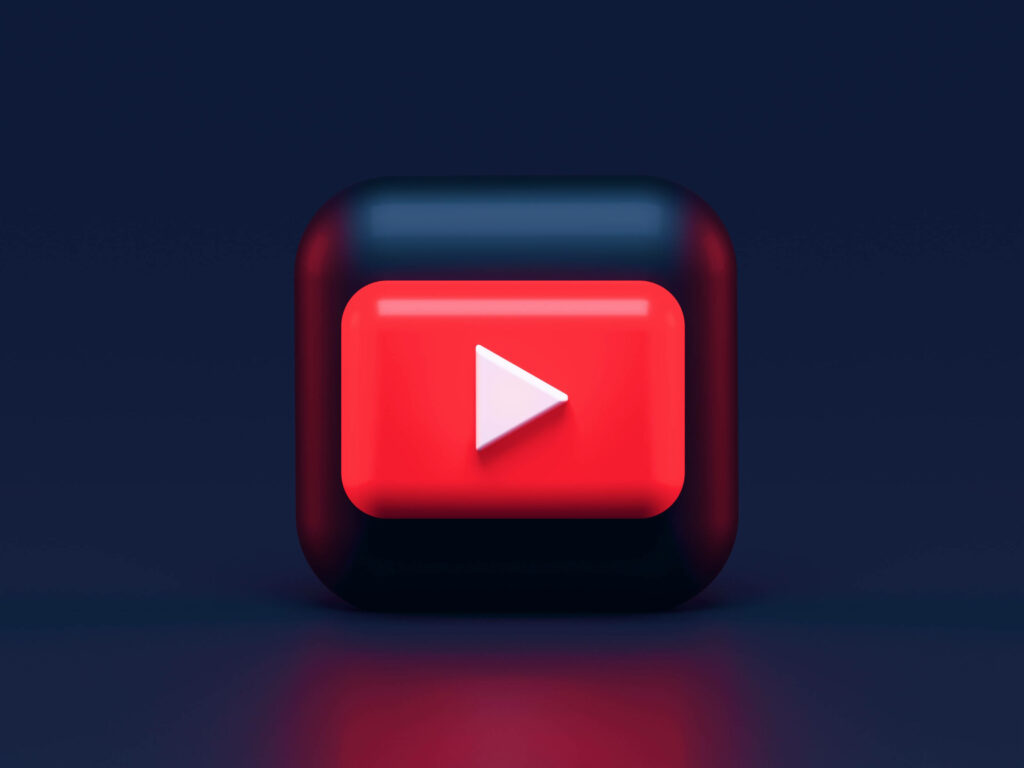 Playful 3D YouTube Logo on Sleek Black Cube: A Dynamic Animated Desktop Wallpaper
