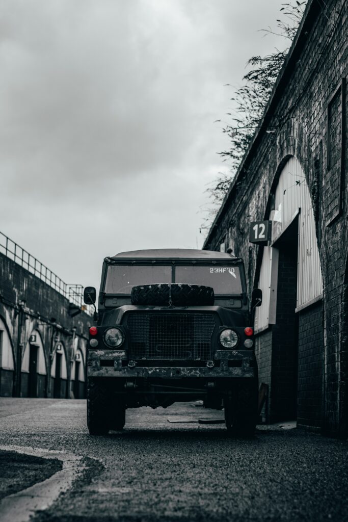 Stunning 4000x6000 Gray SUV Jeep Against Dramatic Industrial Sky Wallpaper