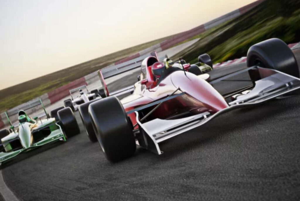 4k close-up of Formula 1 cars racing a sharp corner on track high-speed motorsport wallpaper