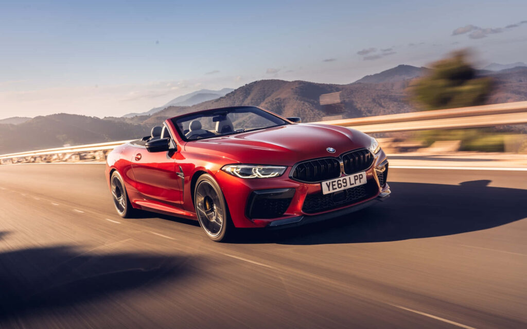Cruising in Style: Red BMW M8 Sets the Road Ablaze in Stunning 4K Wallpaper