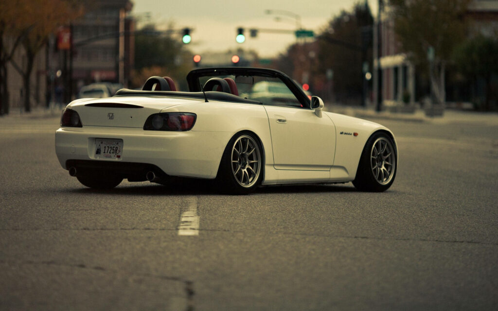 Cruising in Style: Captivating 4k Shot of a White Honda S2000 on Urban Streets - Exquisite Jdm Background Picture Wallpaper