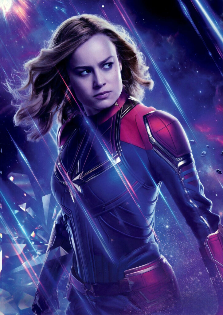 Glowing Marvel: Captivating Carol Danvers Stands Tall Amidst Galactic Majesty Wallpaper