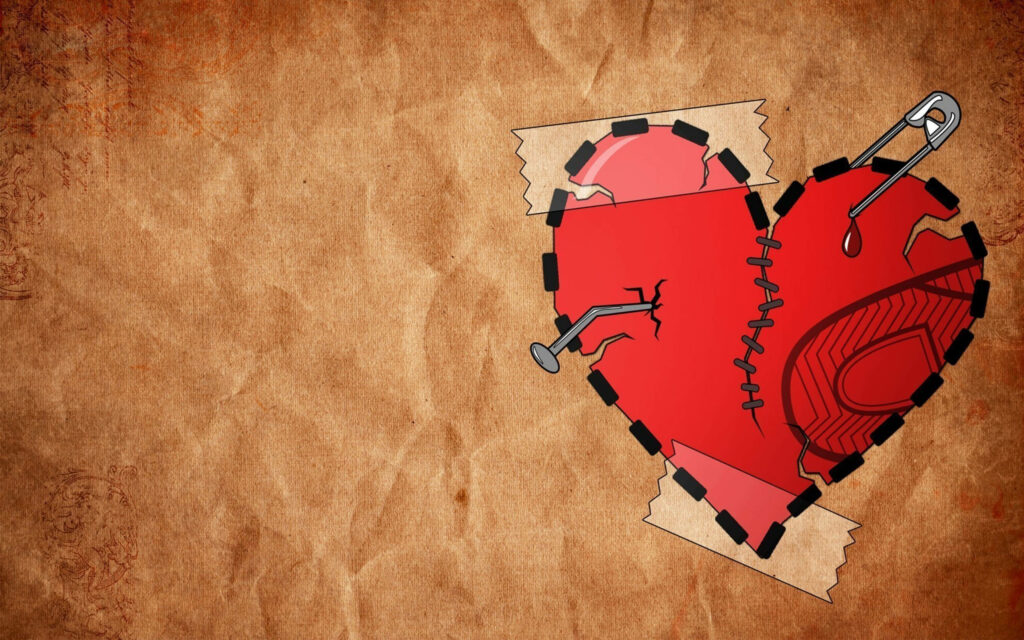 Resilient Heart: 4K Wallpaper of a Patched Red Broken Heart