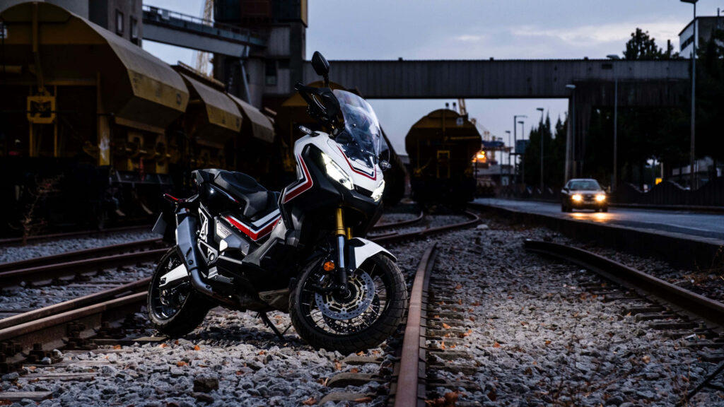 Bold 4K Adventure Bike Wallpaper on Railway Tracks at Dusk