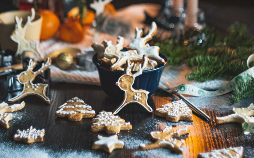 Festive 4K Wallpaper of Decorated Cookies on Rustic Wooden Table