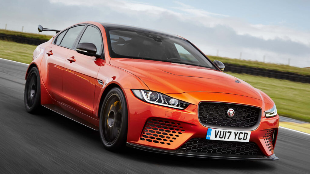 4K Wallpaper: Dynamic Orange Jaguar XE SV on Racetrack