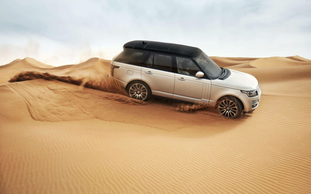 4K Wallpaper of Range Rover in Golden Sand Dunes - Off-Road Power