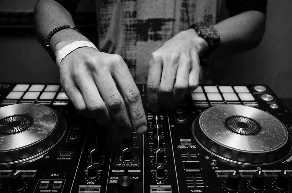 The Master Mixer: A 4k Wallpaper of a Man Perfecting Sound Mixing on a Sound Board