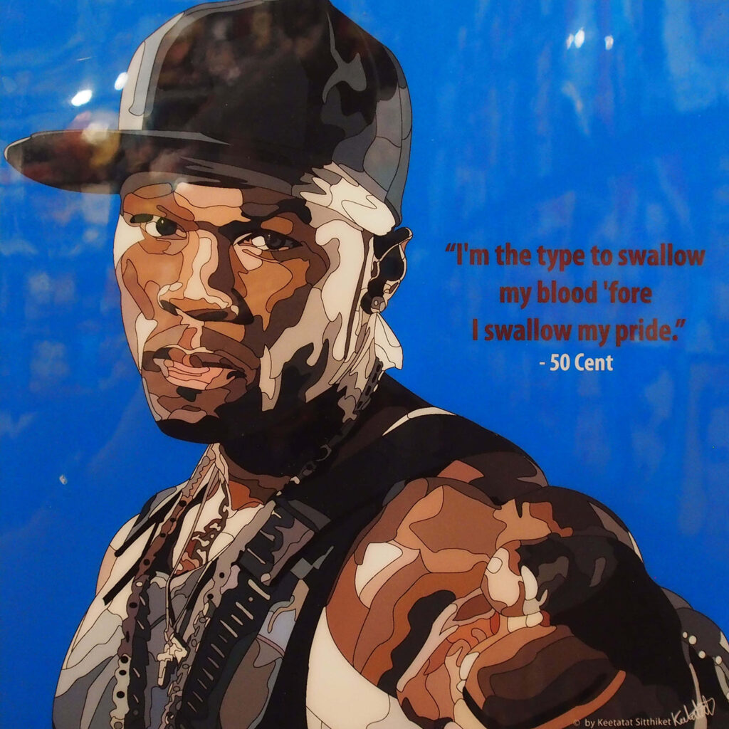 50 Cent confident pose vivid blue background iconic rapper style and swagger wallpaper image