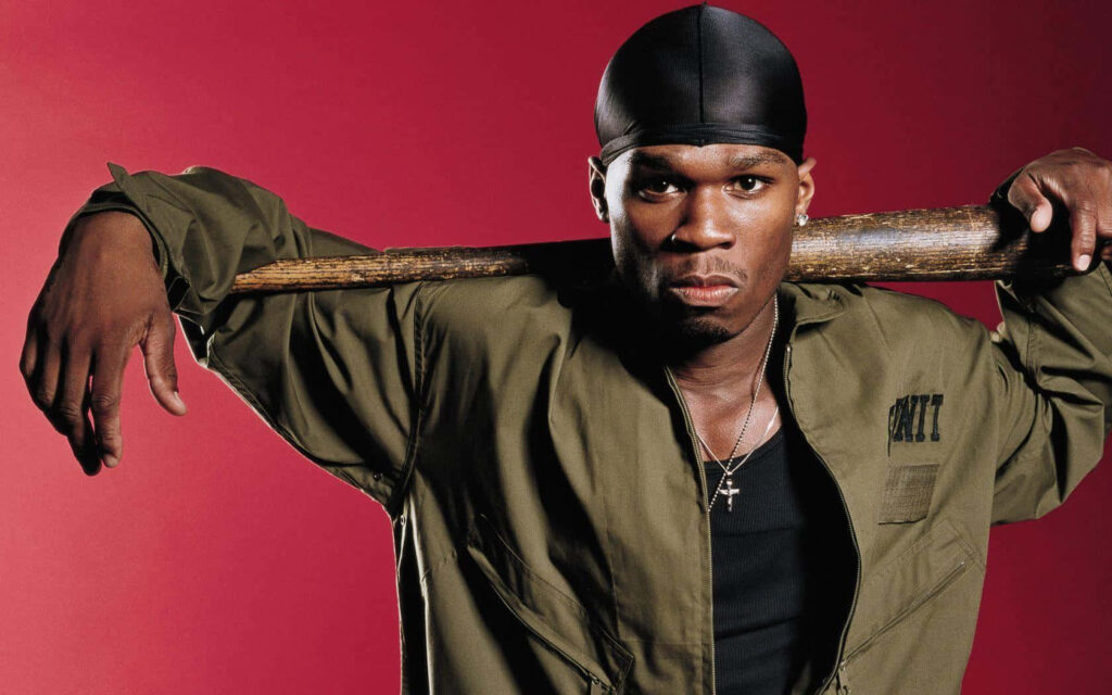 50 Cent confident rapper with baseball bat on shoulders red background intense wallpaper