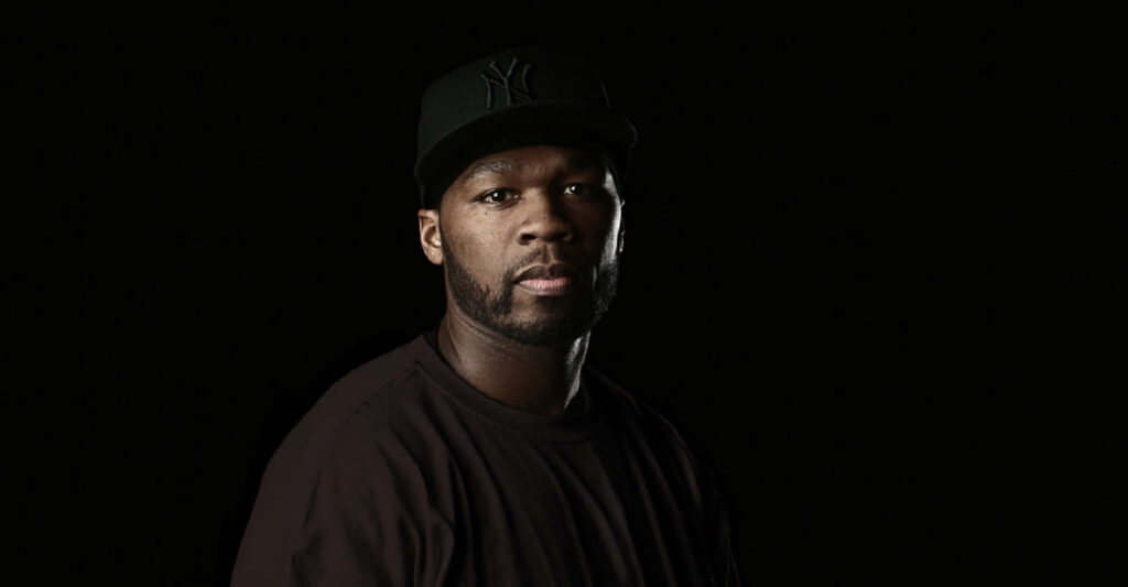 50 Cent rapper wallpaper with strong hood style dark background iconic street presence