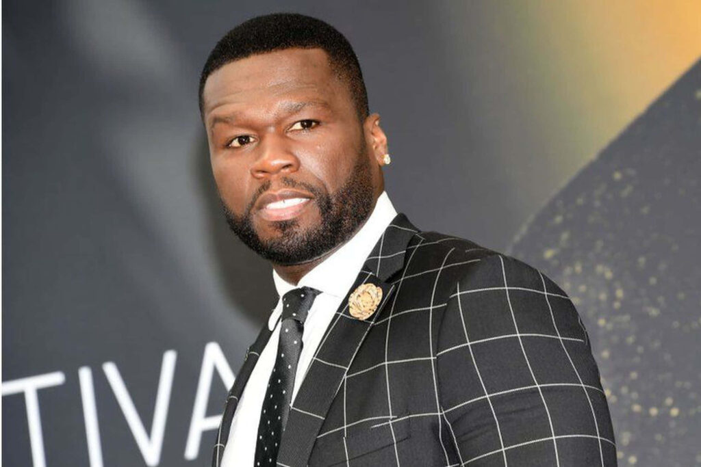 50 Cent in a stylish suit exuding charisma and power iconic rapper wallpaper background