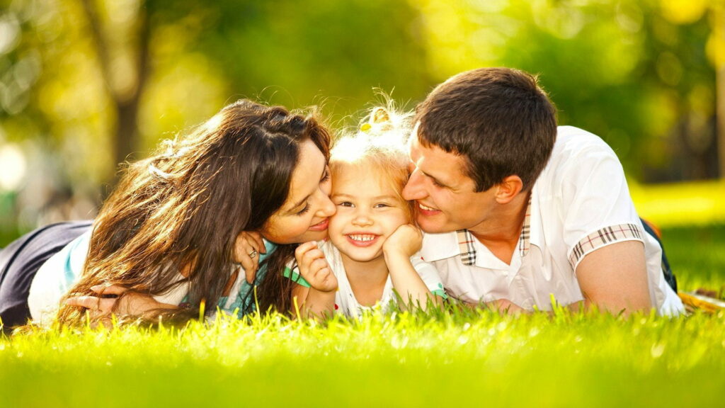 Smiling Together: A Stunning HD Wallpaper of a Happy Family Portrait