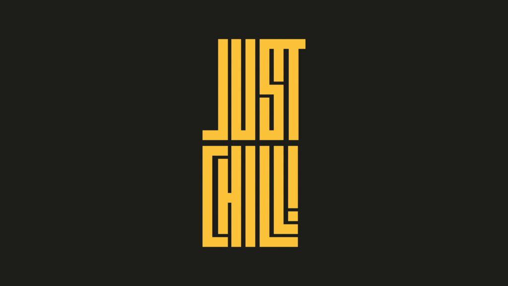 Block-Buster Chill: A Minimalistic Typography Wallpaper In Dark Grey With Yellow 'Just Chill' Motif